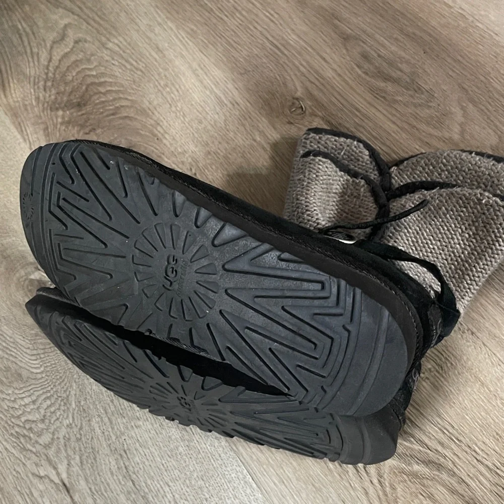 UGG Australia Nyla boots in black suede with a gray knit shaft and buckle strap